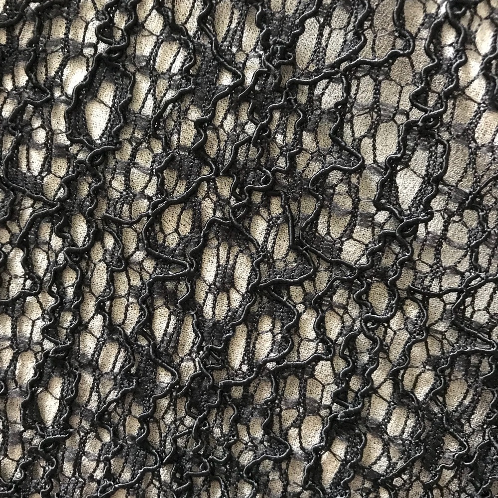 Sleeveless black and cream lace blouse